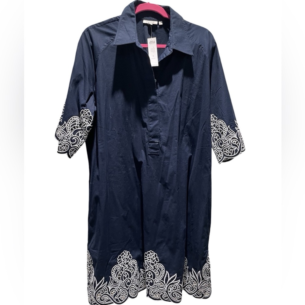 Navy shirt dress with cut out white embroidery at sleeves and hem. Chico’s 3.
